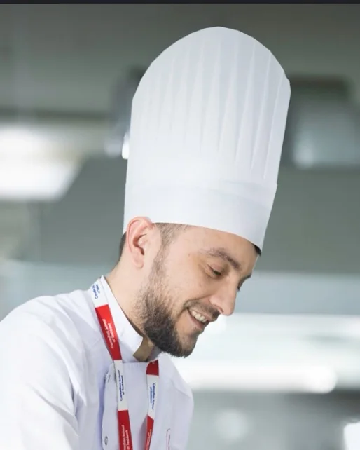 A chef in the CST school kitchen